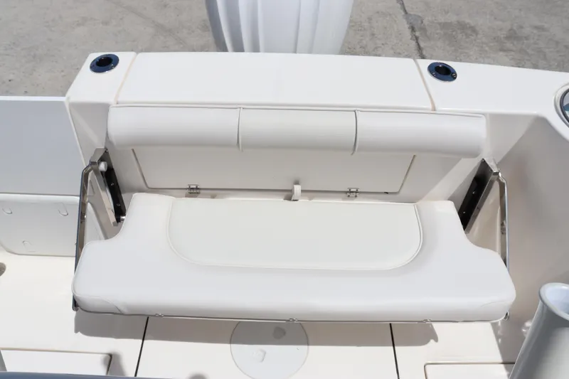 Slide: The Image of 2023 Sea Born SX239 Offshore boat with white cushioned seating. - 14