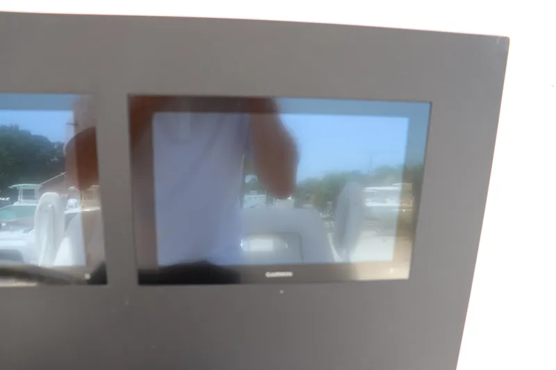 Slide: The Image of 2023 Sea Born SX239 Offshore boat dashboard with Garmin display screens. - 21