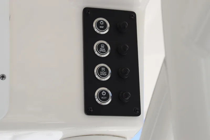 Slide: The Image of Control panel of 2023 Sea Born SX239 Offshore boat with labeled buttons. - 24