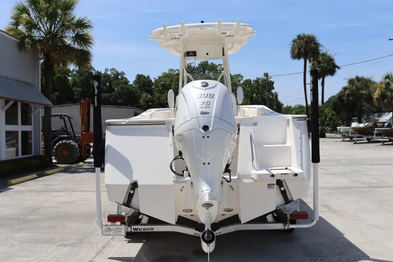 Slide: The Image of 2023 Sea Born SX239 Offshore boat, rear view with outboard motor, parked on trailer. - 4