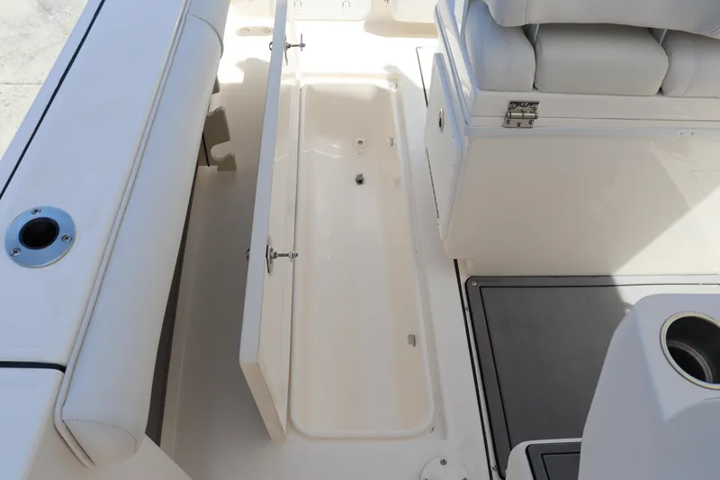 Slide: The Image of 2023 Sea Born SX239 Offshore boat storage compartment open. - 40