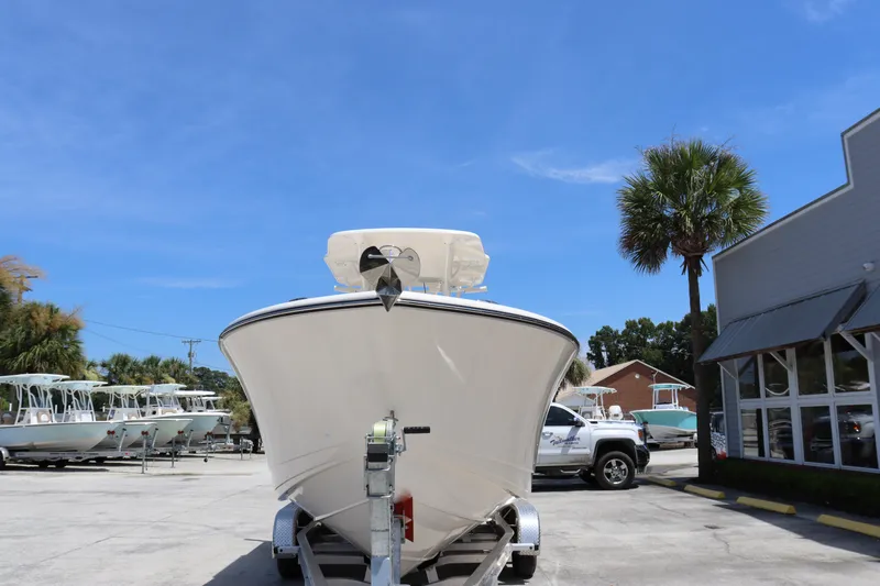 Slide: The Image of 2023 Sea Born SX239 Offshore boat on trailer in marina parking lot. - 7