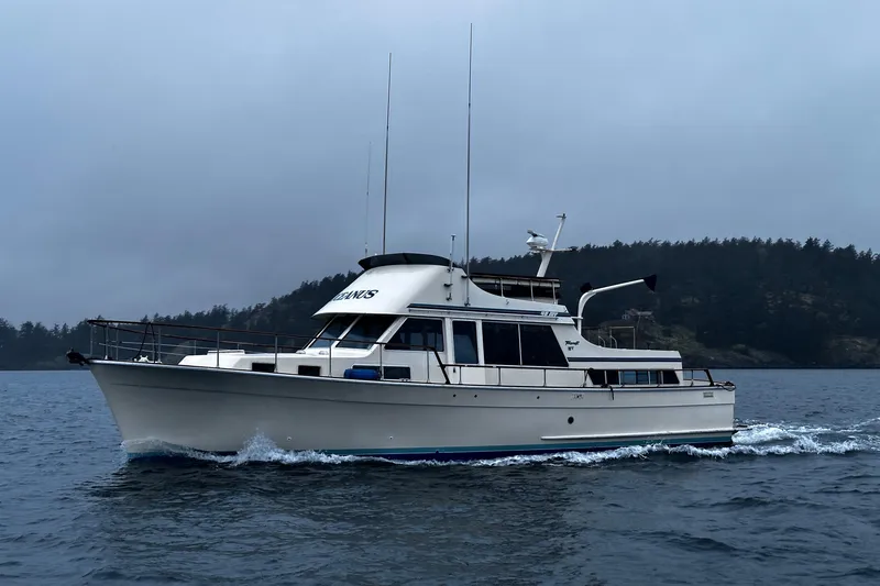 Slide: The Image of 1981 Tollycraft 48 Motor Yacht cruising on a cloudy day. - 36