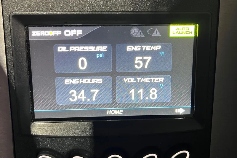 Slide: The Image of Dashboard display of a 2023 MasterCraft NXT21 showing engine metrics and settings. - 14