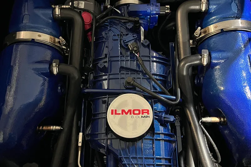 Slide: The Image of 2023 MasterCraft NXT21 Ilmor 6.0L MPI engine with blue components and detailed wiring. - 15