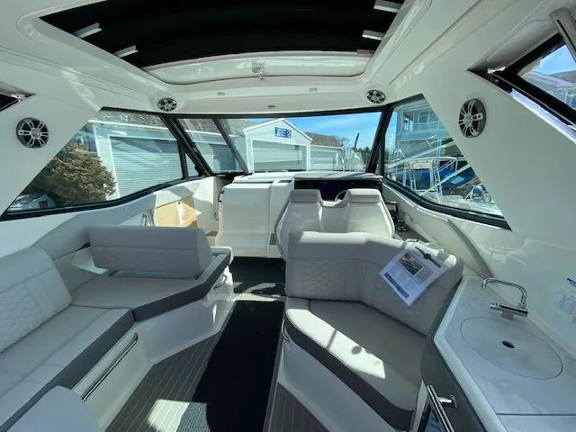 Slide: The Image of Interior of 2024 Sea Ray Sundancer 320 OB, featuring luxurious seating and modern amenities. - 2