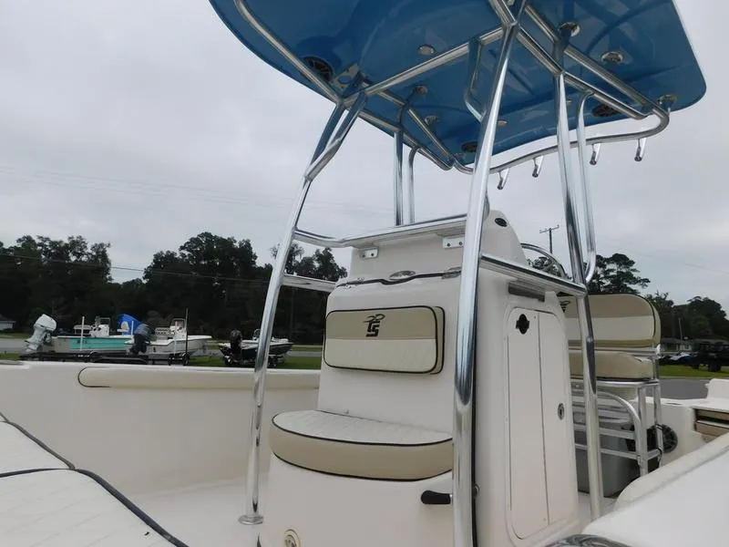 Slide: The Image of 2023 Carolina Skiff 21 LS boat with blue T-top and seating. - 7