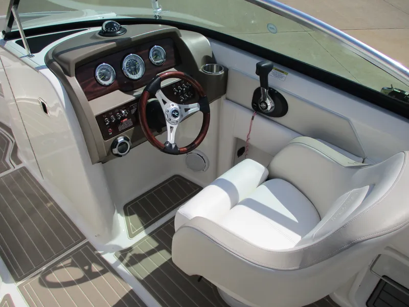 Slide: The Image of Interior of 2012 Sea Ray 220 Sundeck with steering console. - 3