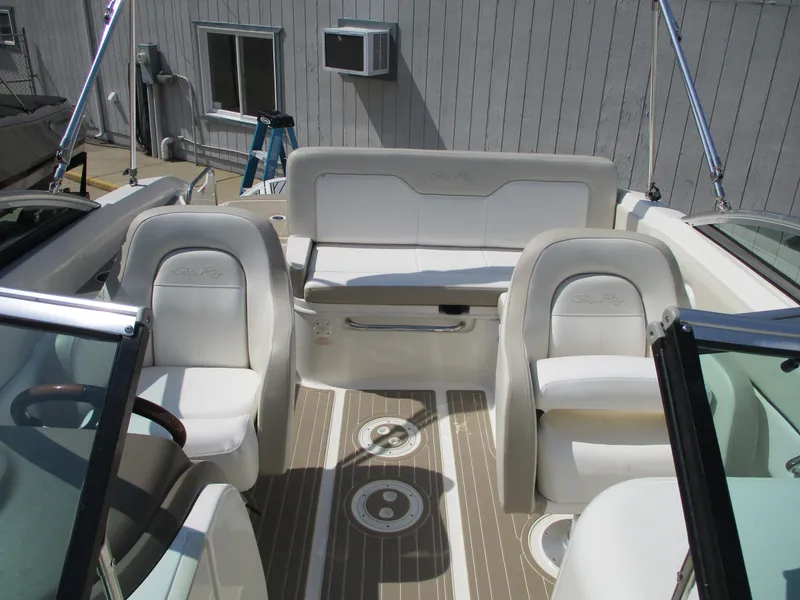 Slide: The Image of Interior of a 2012 Sea Ray 220 Sundeck with white seating. - 7