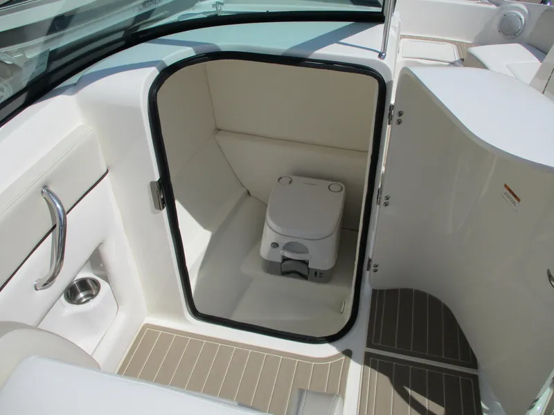 Slide: The Image of Interior of 2012 Sea Ray 220 Sundeck featuring a toilet. - 8