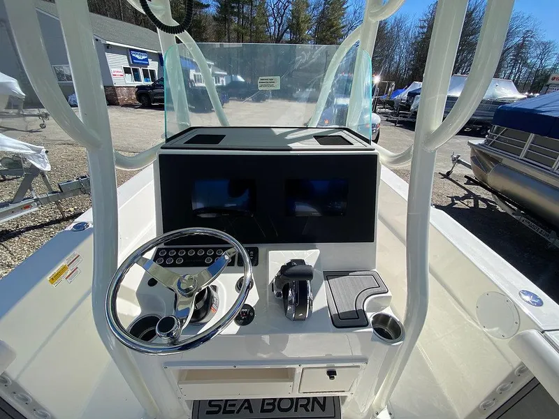 Slide: The Image of 2023 Sea Born LX 22 LE boat console with steering wheel and dual displays. - 5