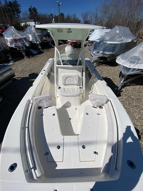 Slide: The Image of 2023 Sea Born LX 22 LE boat, white interior, outdoor display. - 7