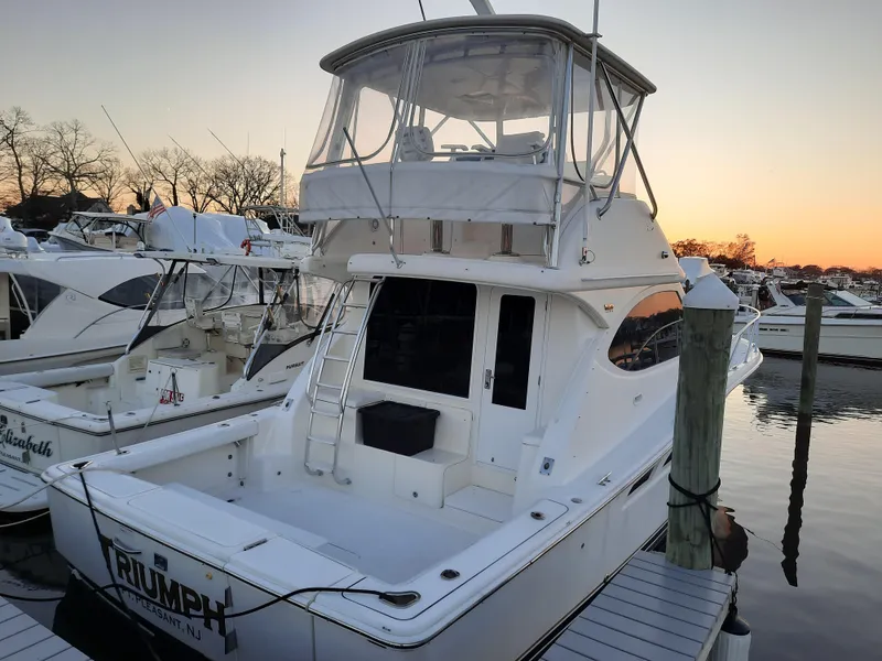 Slide: The Image of 2008 Tiara Yachts 3900 Convertible docked at sunset. - 11