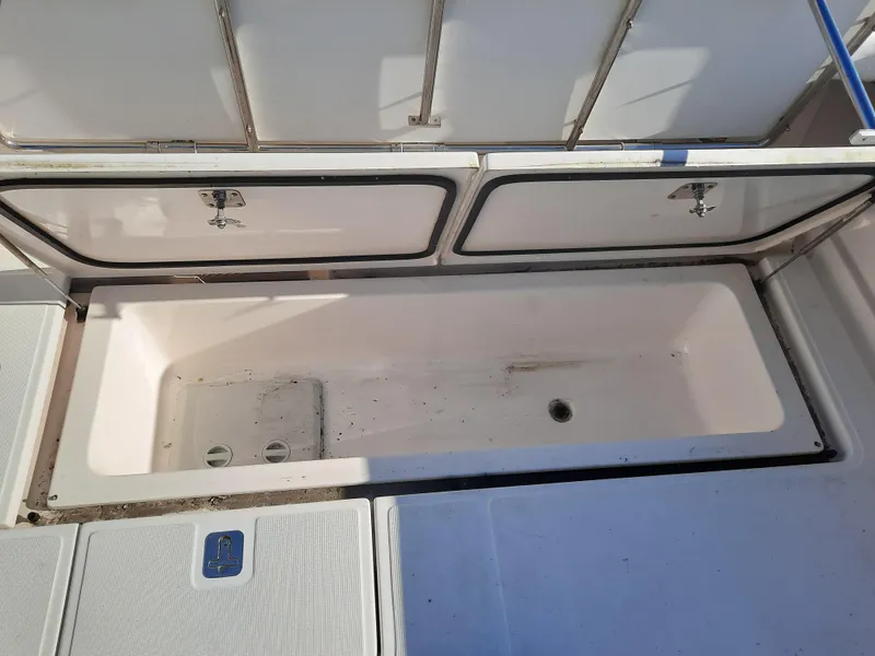 Slide: The Image of 2008 Tiara Yachts 3900 Convertible storage compartment with open hatches. - 17