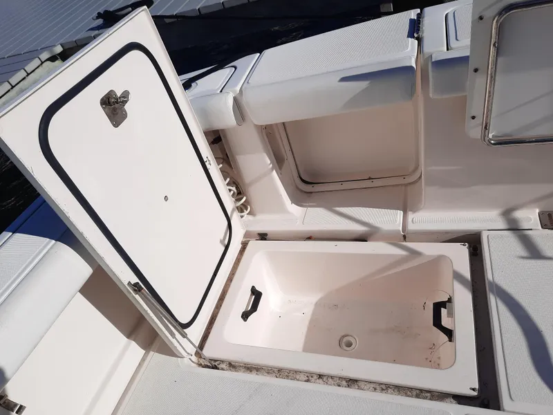 Slide: The Image of Open storage compartments on a 2008 Tiara Yachts 3900 Convertible boat. - 18