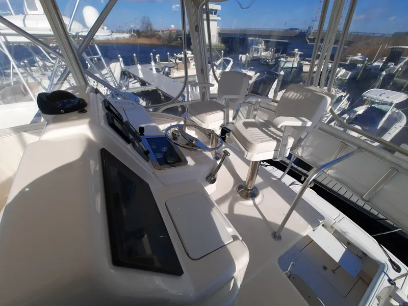 Slide: The Image of 2008 Tiara Yachts 3900 Convertible helm station with dual captain chairs. - 20