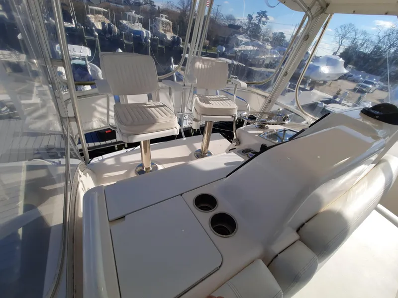 Slide: The Image of 2008 Tiara Yachts 3900 Convertible cockpit with helm chairs and control panel. - 31