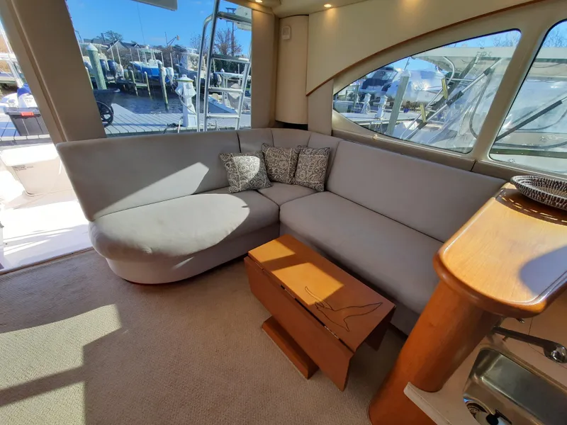 Slide: The Image of Interior of 2008 Tiara Yachts 3900 Convertible with a spacious, sunlit lounge area. - 39