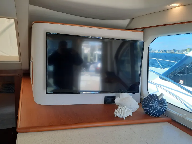 Slide: The Image of Flat-screen TV in the cabin of a 2008 Tiara Yachts 3900 Convertible. - 43