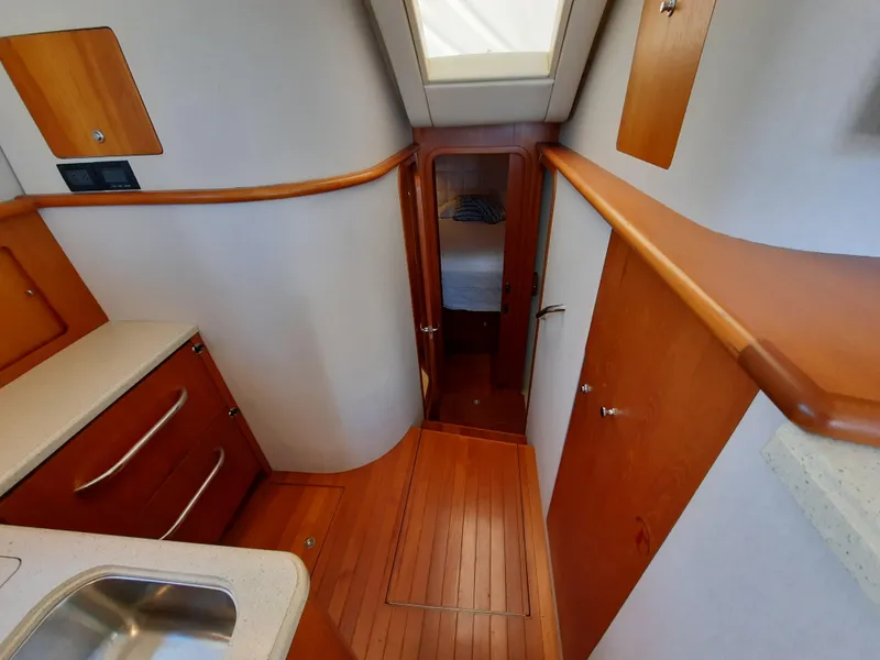 Slide: The Image of 2008 Tiara Yachts 3900 Convertible interior with wooden finishes and modern amenities. - 46
