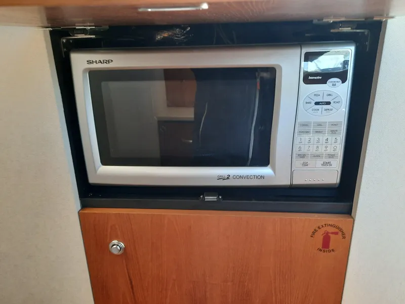 Slide: The Image of Sharp microwave in the galley of a 2008 Tiara Yachts 3900 Convertible. - 49