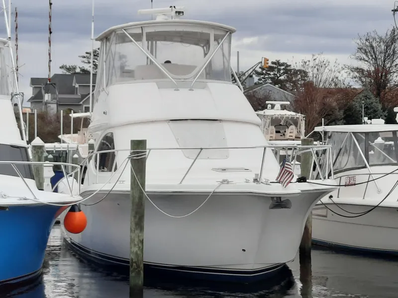 Slide: The Image of 2008 Tiara Yachts 3900 Convertible docked at a marina. - 9