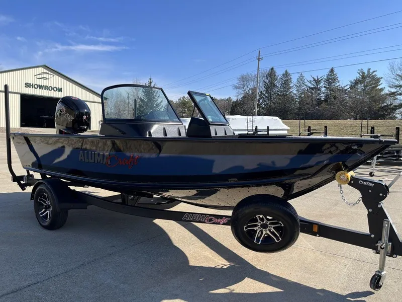 Slide: The Image of 2023 Alumacraft Competitor 175 Sport boat on trailer outside showroom. - 3