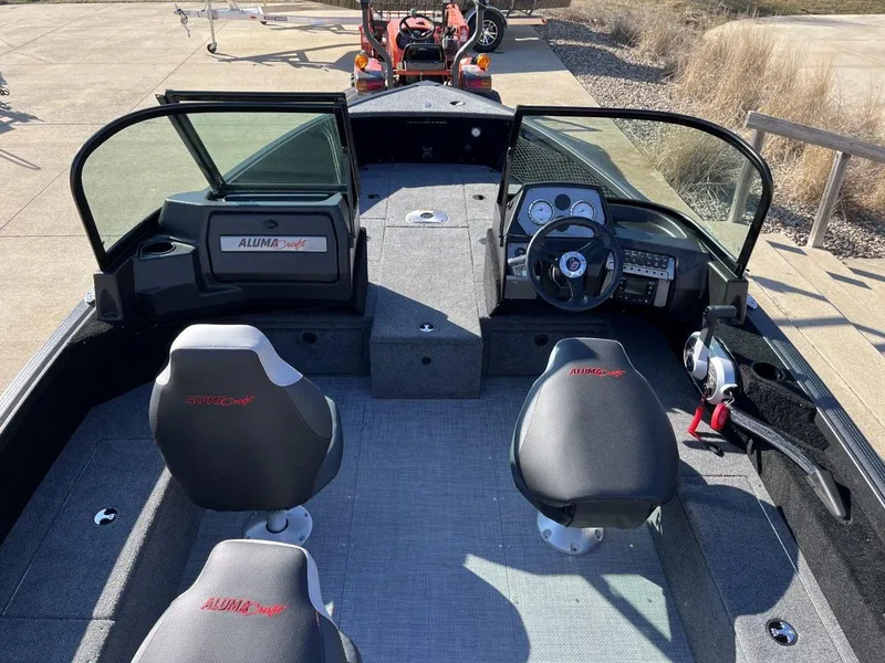 Slide: The Image of 2023 Alumacraft Competitor 175 Sport boat interior with dual seats and control console. - 4