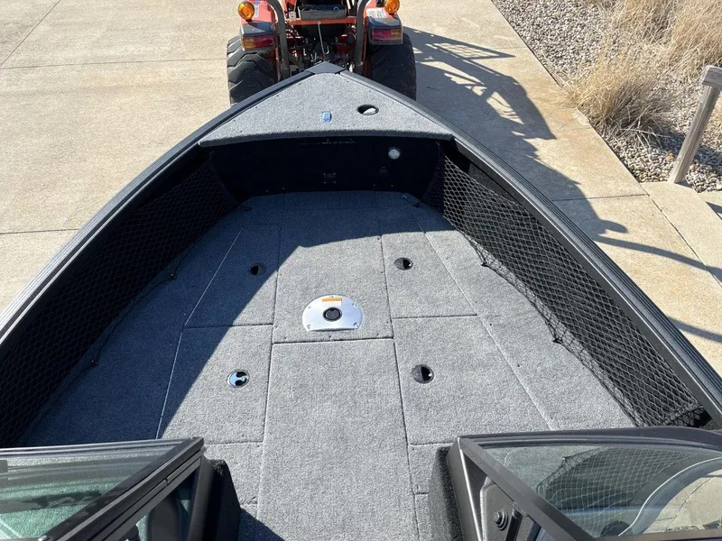 Slide: The Image of 2023 Alumacraft Competitor 175 Sport boat interior with carpeted deck. - 5