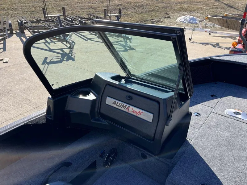 Slide: The Image of 2023 Alumacraft Competitor 175 Sport boat interior with open windshield. - 6