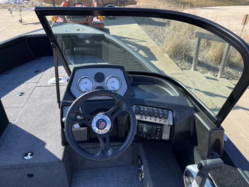 Slide: The Image of 2023 Alumacraft Competitor 175 Sport boat dashboard and steering wheel. - 7