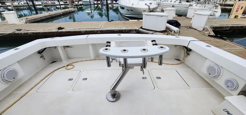 Slide: The Image of Fishing deck of a 2000 Viking 55 Convertible yacht at a marina. - 10