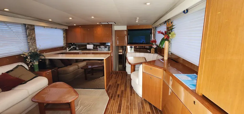 Slide: The Image of Luxurious interior of a 2000 Viking 55 Convertible yacht with elegant wood finishes. - 11