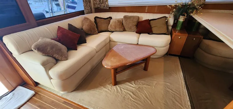 Slide: The Image of Luxurious interior of 2000 Viking 55 Convertible yacht with plush seating and cushions. - 12