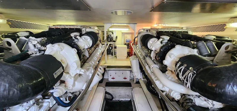 Slide: The Image of Engine room of a 2000 Viking 55 Convertible yacht, showcasing dual engines. - 21