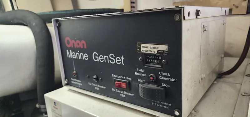 Slide: The Image of Onan Marine GenSet control panel on a 2000 Viking 55 Convertible yacht. - 22