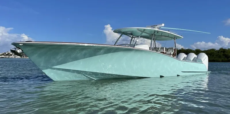 The Image of 2025 Mag Bay 43 Center Console boat on clear water with blue sky. - 0