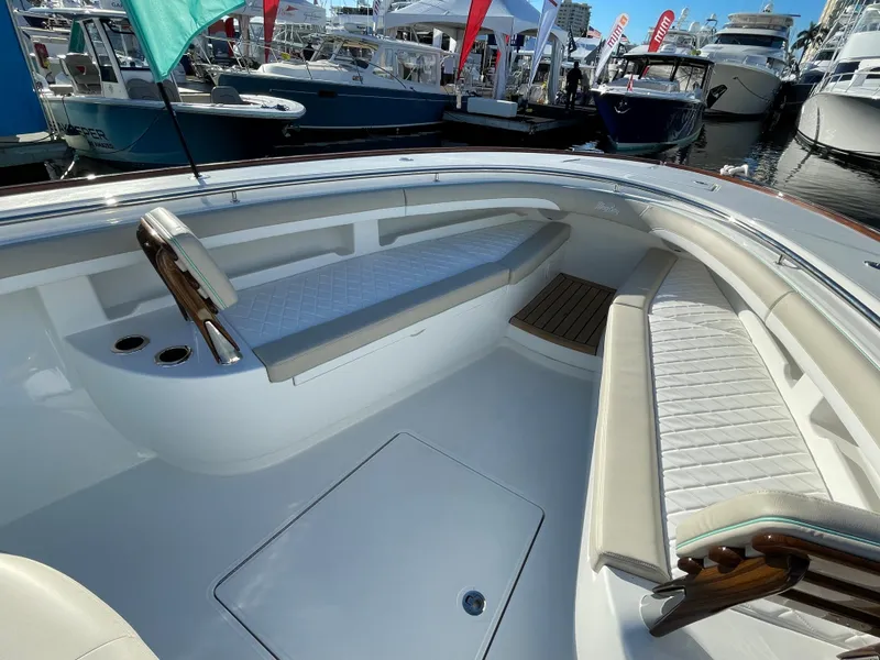 Slide: The Image of 2025 Mag Bay 43 Center Console boat interior at a marina. - 12