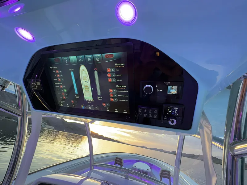 Slide: The Image of Mag Bay 43 Center Console 2025 dashboard with advanced navigation system at sunset. - 22