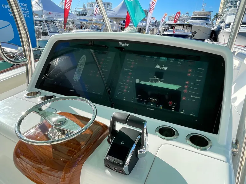 Slide: The Image of 2025 Mag Bay 43 Center Console helm with advanced touchscreen display and controls. - 23