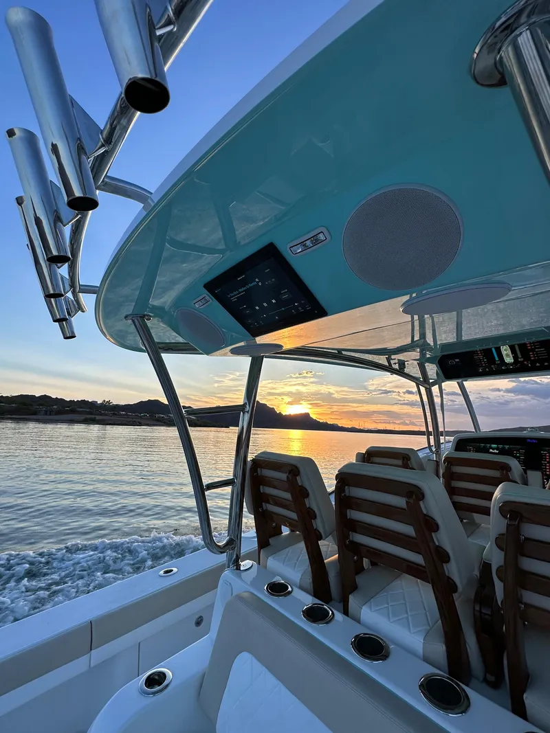 Slide: The Image of 2025 Mag Bay 43 Center Console boat at sunset on the water. - 25