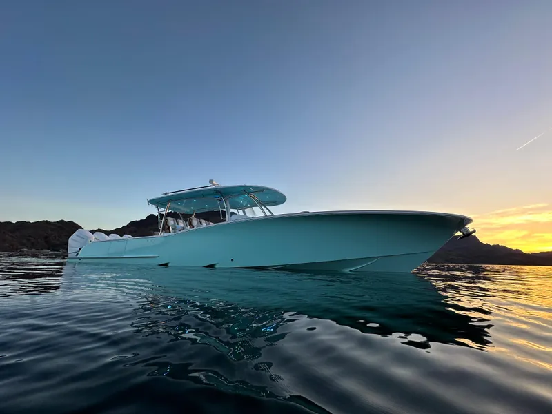 Slide: The Image of 2025 Mag Bay 43 Center Console boat with Mercury outboard engine on water. - 7