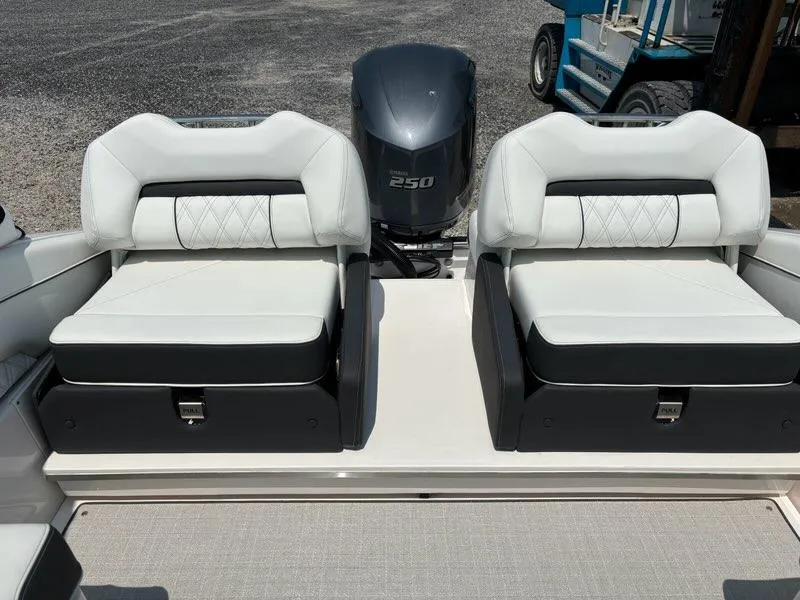 Slide: The Image of 2025 Regal LX4 boat with dual white and black cushioned seats and 250 HP outboard motor. - 4