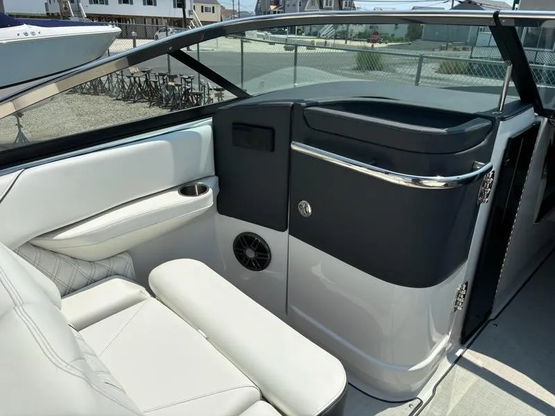 Slide: The Image of 2025 Regal LX4 boat interior with white leather seating and modern design. - 6