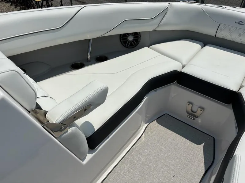 Slide: The Image of 2025 Regal LX4 boat interior with white leather seating and built-in speakers. - 9