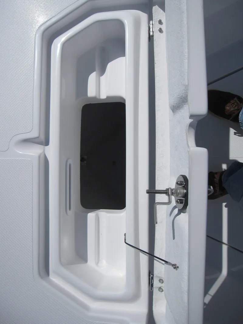 Slide: The Image of 2023 Clearwater 2300 boat storage compartment with open hatch - 11