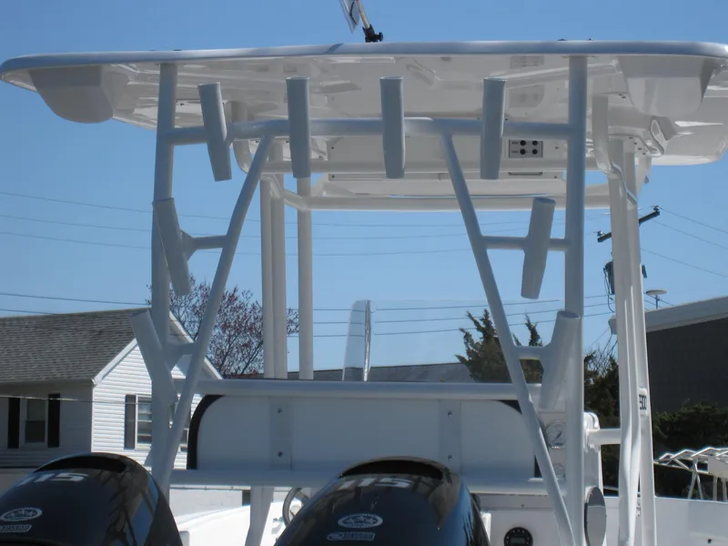 Slide: The Image of 2023 Clearwater 2300 boat with dual engines and T-top. - 27