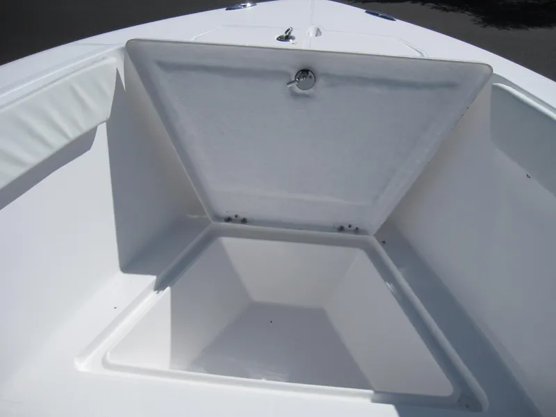 Slide: The Image of 2023 Clearwater 2300 boat storage compartment open. - 10
