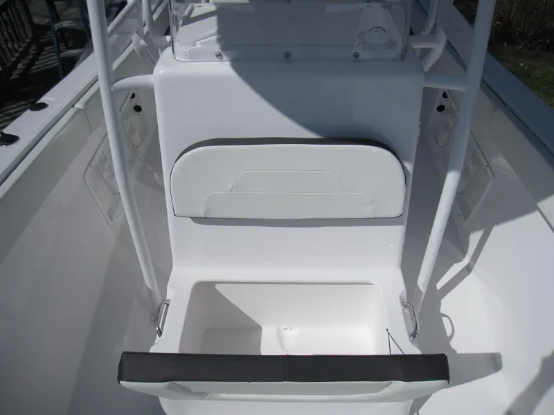 Slide: The Image of 2023 Clearwater 2300 boat interior seating and storage compartment. - 13