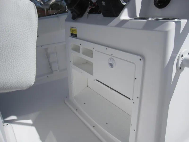 Slide: The Image of Clearwater 2300 boat console storage compartments, 2023 model. - 22